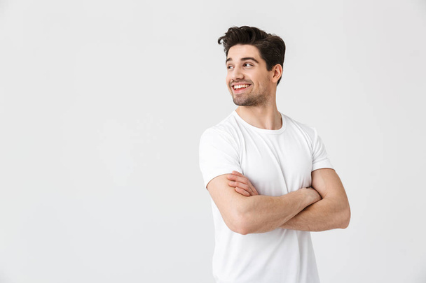 Happy young excited emotional man posing isolated over white wall background. - Valokuva, kuva