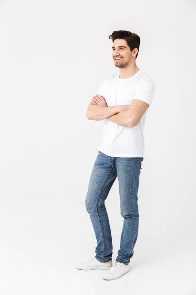 Happy young excited emotional man posing isolated over white wall background. - Foto, Bild