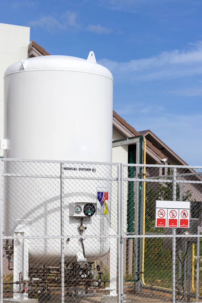 Liquid oxygen tank in hospital with warning label for safety con - Photo, Image