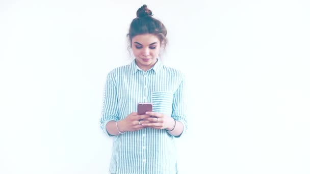 Young woman using mobile phone - Video