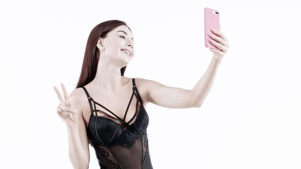 Fitness girl In black Lingerie Making content for her social networks - Valokuva, kuva
