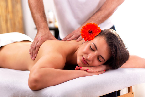 Charming lady having a back massage  - Photo, Image