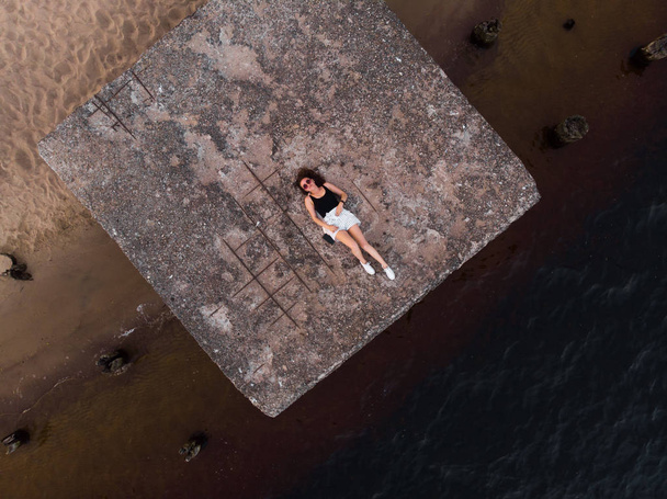 Lonely woman alone - Beautiful aerial Riga port and river Daugava lanscape shots from drone - Top view from above - Photo, Image