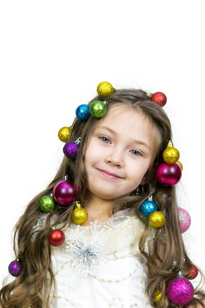 Girl with Christmas decorations on her head. - Foto, afbeelding