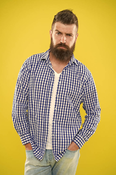 Having some doubts. Beard fashion and barber concept. Man bearded hipster beard yellow background. Barber tips maintain beard. Stylish beard mustache care. Hipster appearance. Emotional expression - Photo, Image