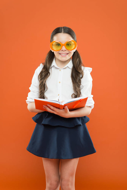 Study foreign language. Study literature. Pupil likes study. The more you know the more you grow. Small girl enjoying her school time. Happy little schoolgirl ready for lesson. Cute child with book - Fotografie, Obrázek