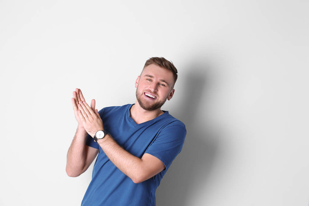 Portrait of handsome laughing man on white background - Foto, Bild