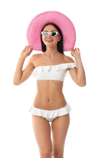 Beautiful young woman in stylish bikini with hat on white background - Photo, Image
