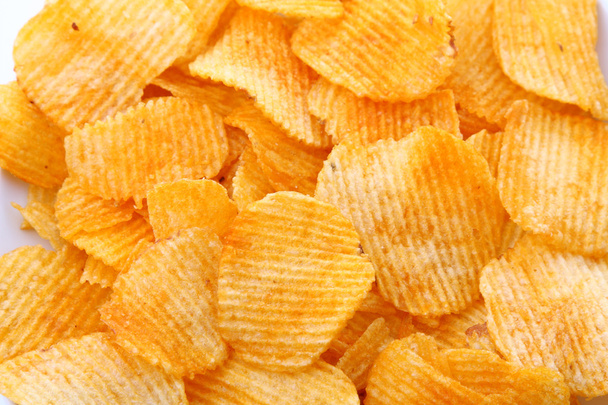 Corrugated potato chips background - Fotoğraf, Görsel