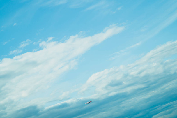 Airplane landing down. passenger aircraft with the cloudscape - Fotó, kép