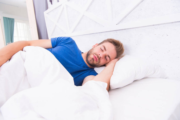 Tips sleeping better. Bearded man sleeping face relaxing. Maintaining consistent circadian rhythm is essential for general health. Man handsome guy sleeping. Get enough amount of sleep every night - Valokuva, kuva