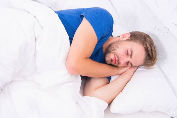 Get enough amount of sleep every night. Bearded man sleeping face relaxing. Maintaining consistent circadian rhythm is essential for general health. Man handsome guy sleeping. Tips sleeping better - Photo, image