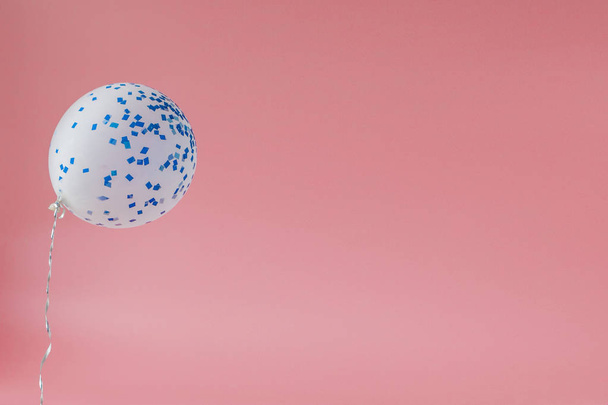 Festive pink background. Shining stars and balloon on light pink - 写真・画像