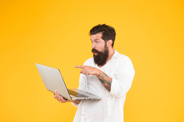 Bearded man with notebook. Online shopping. Man using notebook. Digital world. Programming concept. Programmer with laptop. Surfing internet. In search of inspiration. Online payment. Online purchase - Zdjęcie, obraz