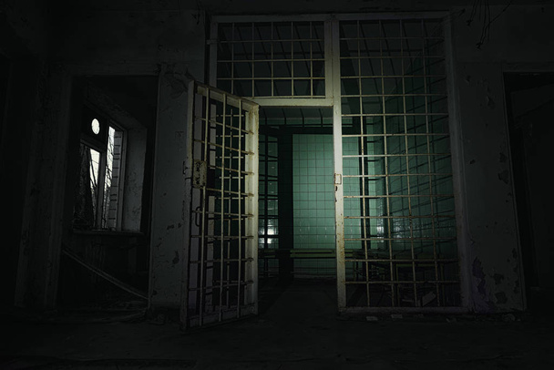 Old abandoned prison cell in the dark - Foto, immagini