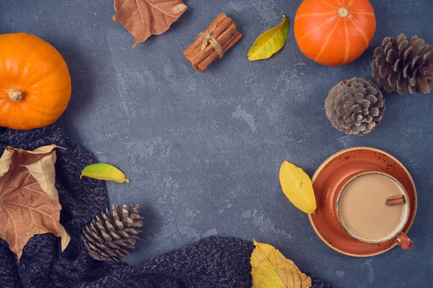 Autumn concept with coffee cup, pumpkin and fall leaves over bla - Foto, Imagem