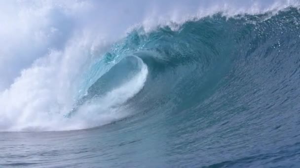 SLOW MOTION, CLOSE UP: Picturesque barrel wave splashes and sprays glassy ocean water near the sunny coast of Teahupoo, Tahiti. Wild breaking wave surging from the Pacific glistens in the summer sun. - Footage, Video