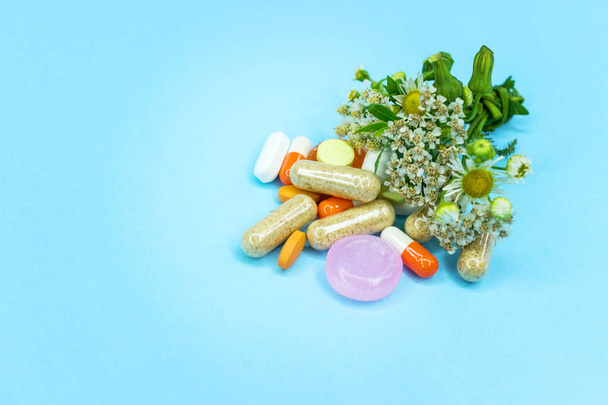 Detail of cannabis buds and prescriptions pills over reflective surface - medical marijuana dispensary concept - Photo, Image