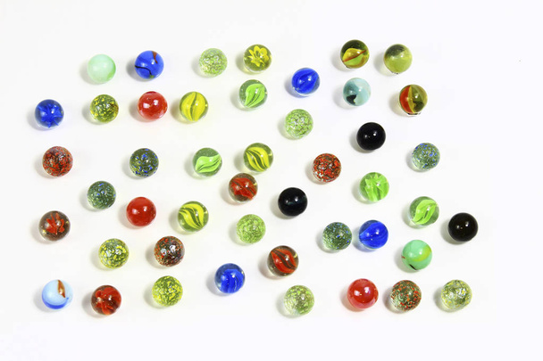 Background-of-various-multicolored-marbles-on-white - Фото, изображение