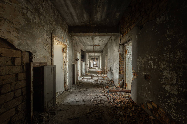 Abandoned corridor in damaged building - Фото, зображення
