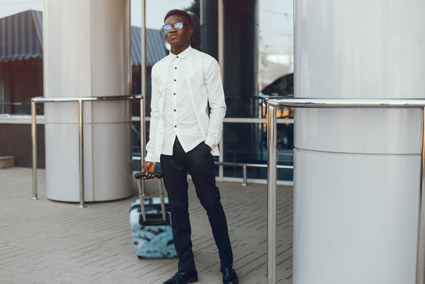 Elegant black man in a summer city - Photo, Image