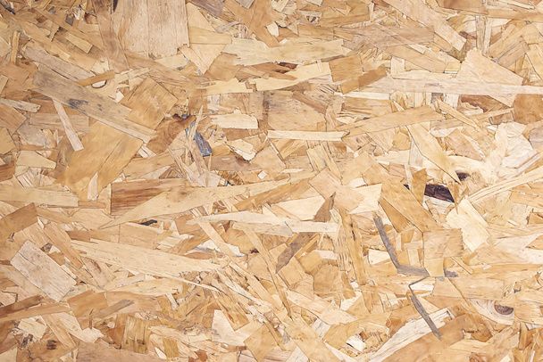 Gerecycled gecomprimeerd hout spaanplaat voor interieur decoratie. - Foto, afbeelding