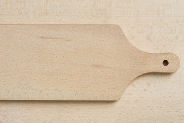 cutting board on wooden background texture  - Fotografie, Obrázek