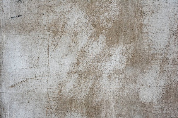 betonfal szerkezete repedésekkel és karcolásokkal, amelyek háttérként használhatók - Fotó, kép