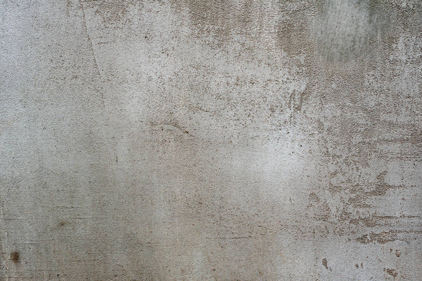 Texture of a concrete wall with cracks and scratches which can be used as a background - Φωτογραφία, εικόνα