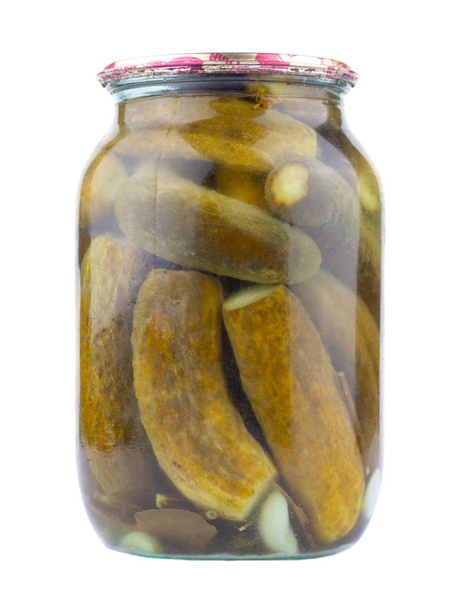 liter jar of pickled cucumbers on a white background, salted isolated gherkins - Photo, Image