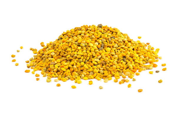 a small heap of bee pollen anules isolated on white background - Photo, Image