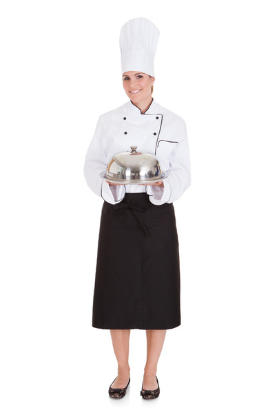 Portrait Of Female Chef Holding Tray - Foto, Imagen