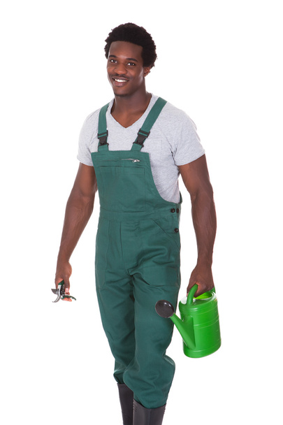 Gardener With Watering Can And Pliers - Foto, Imagen