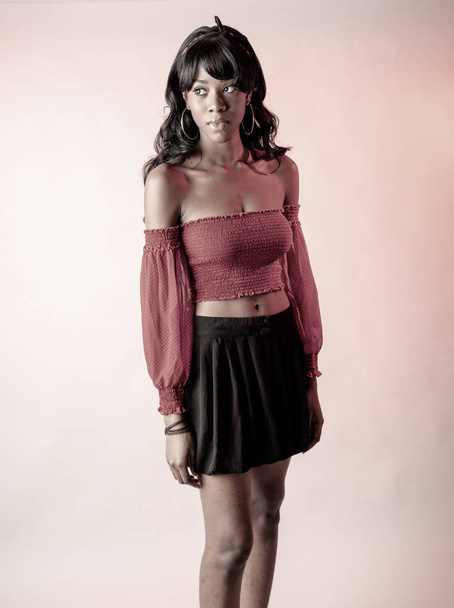 African American woman in red top and black skirt - Foto, immagini