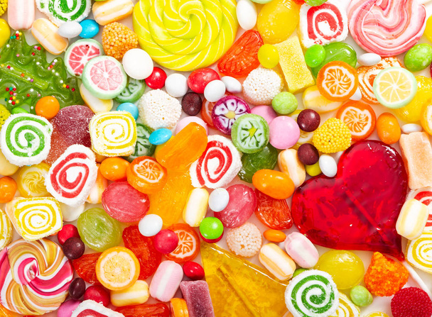 Colorful lollipops and different colored round candy.   - Photo, Image