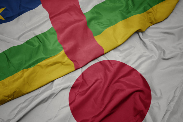 acenando bandeira colorida do japão e bandeira nacional da república centro-africana
. - Foto, Imagem