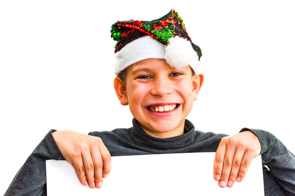 Teen boy wearing Santa hat, Teenager child holding empty Christm - Photo, Image