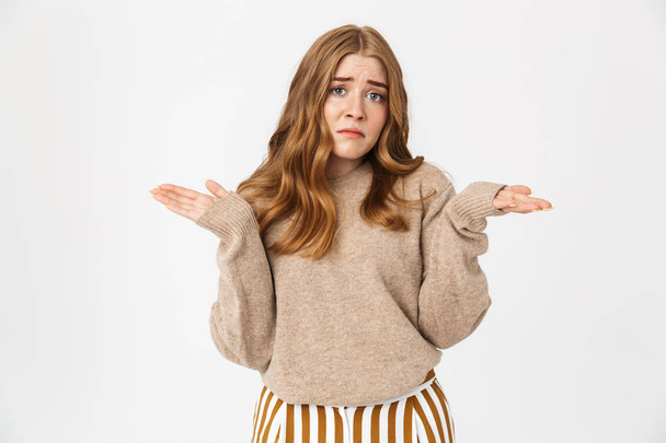 Attractive young girl wearing sweater standing isolated - Foto, immagini