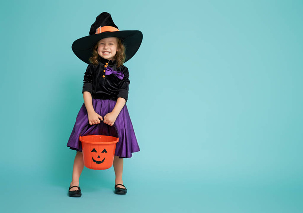 little witch on turquoise background - Fotó, kép