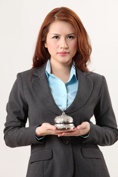 Woman holding a desk bell - Photo, image