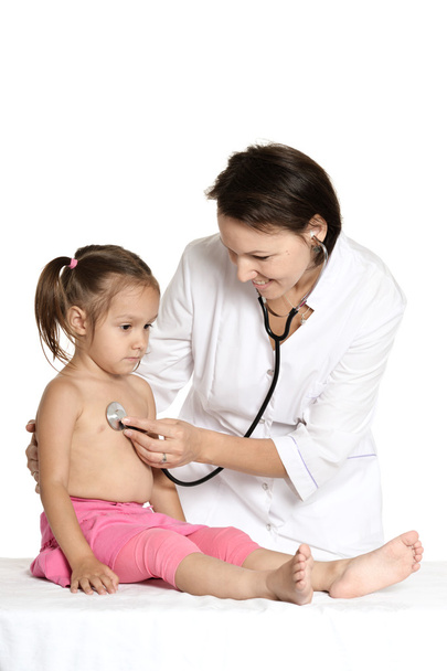 Little girl visiting the pediatrician - Фото, изображение