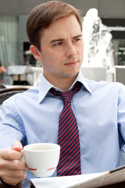 Портрет бізнесмена з чашкою Ресторан Коув
 - Фото, зображення