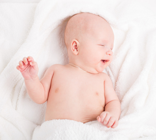 Cute baby wrapped into towels - 写真・画像