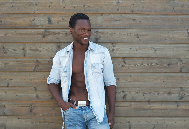 Black man posing outdoors with open shirt - Photo, Image