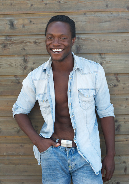 Attractive male model smiling outdoors - Fotó, kép