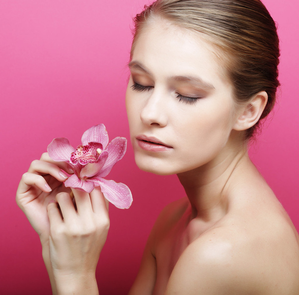 Woman with orchid flower - Foto, Imagen