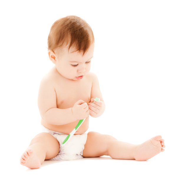 Curious baby brushing teeth - Foto, afbeelding