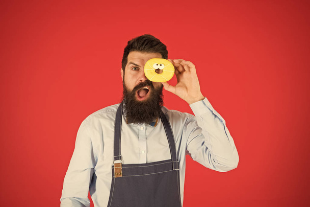 Calorie. Chef feel hunger. Calorie counting. Diet and healthy food. gain calorie. Bearded man in chef apron. Chef man in cafe. Food calorie. baker hold donut. Funny hipster chef. Cook at work - Photo, image