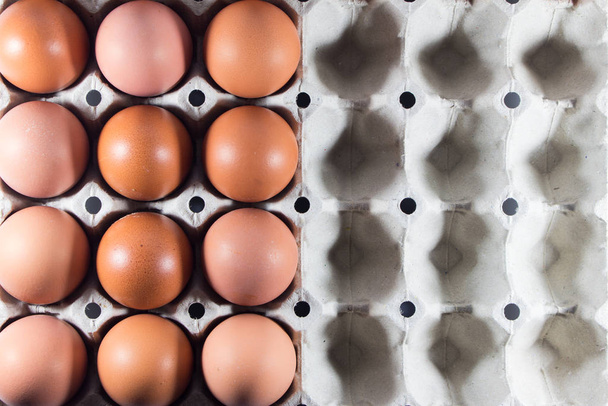 Fresh eggs from the farm in the panel white paper. - Foto, Imagen
