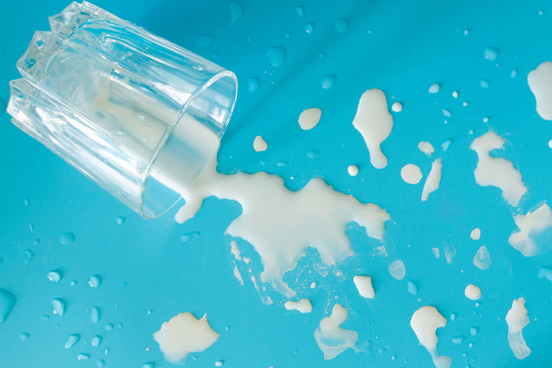Milk splashes on blue background - Foto, Imagem